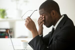 man suffering from chronic stress at work